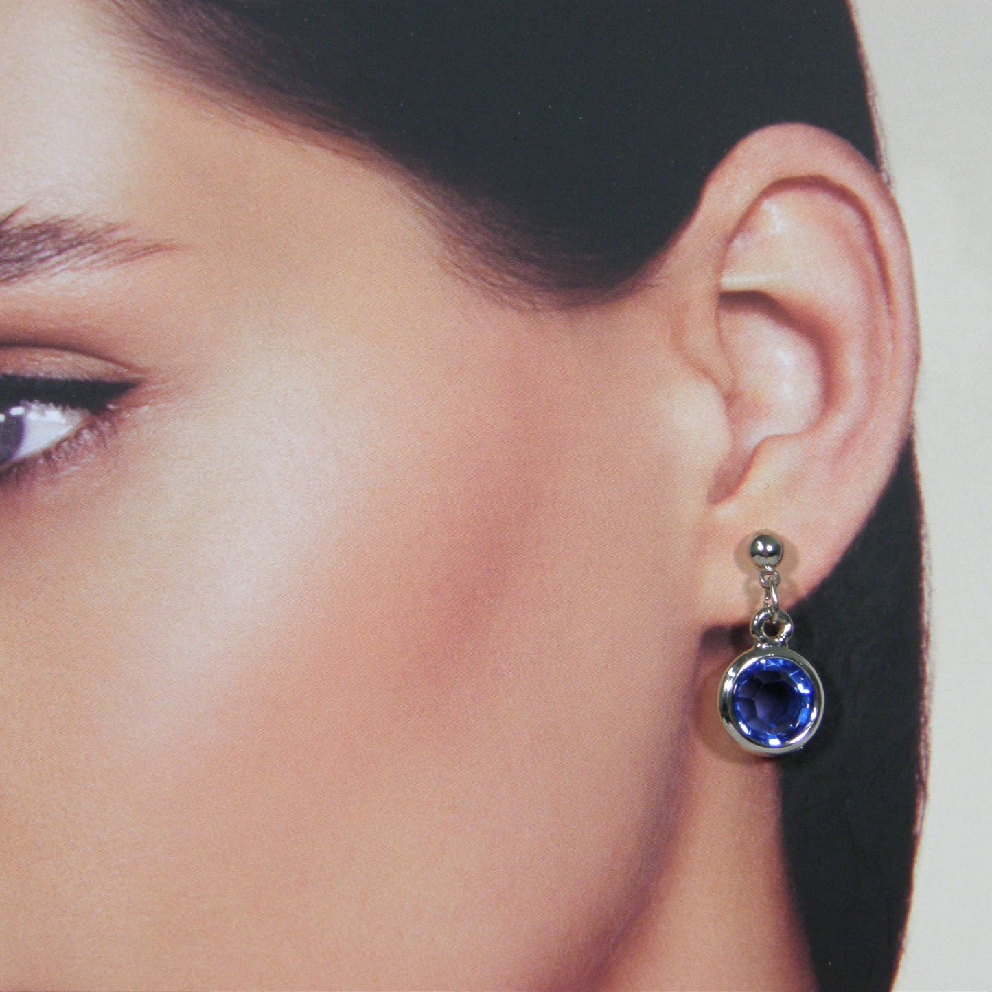 Zilveren roos geslepen saffier kristallen oorhanger