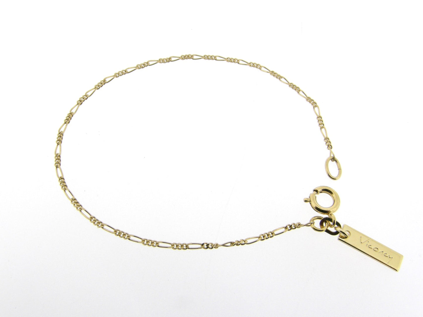 Gouden armbandje met figaro schakeltjes aan beiden zijden vlak geslepen