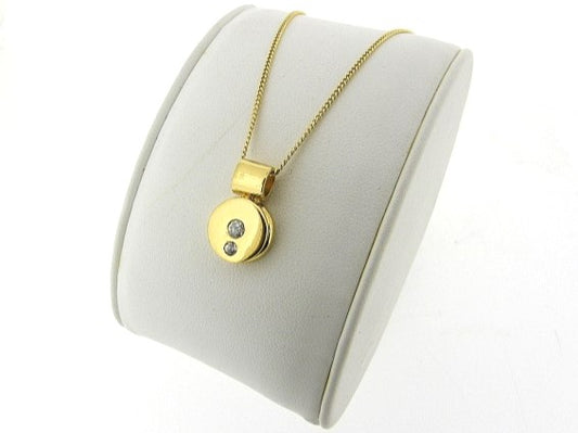 Gouden ketting met rond hangertje met zirconia steentjes